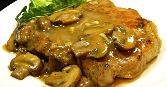 Pork Chops in Garlic Mushroom Sauce • Delish Club